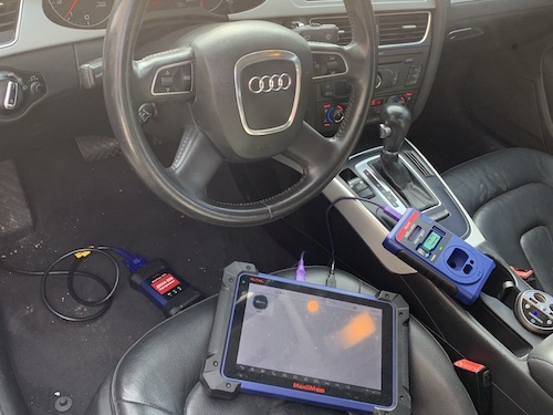Using our computer to hook into the computer on this Audi so we can program new key fobs.